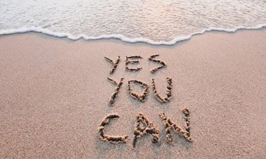 Schriftzug Yes you can, der in den Sand geschrieben ist